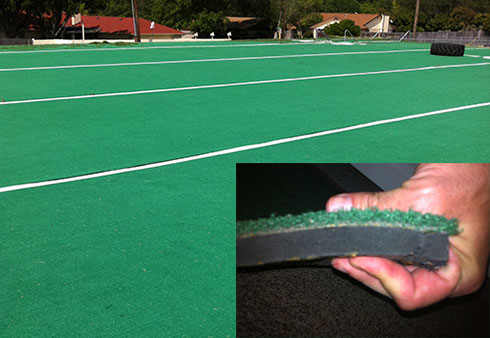 Old style AstroTurf surface, short carpet-like turf