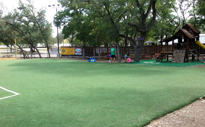 Large artificial grass lawn at a restaurant playground